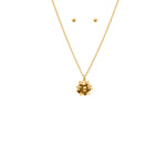 gold gift bow necklace with round stud earrings